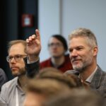 Person raising their hand