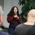 Person speaking into a microphone