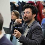 Person speaking into a microphone